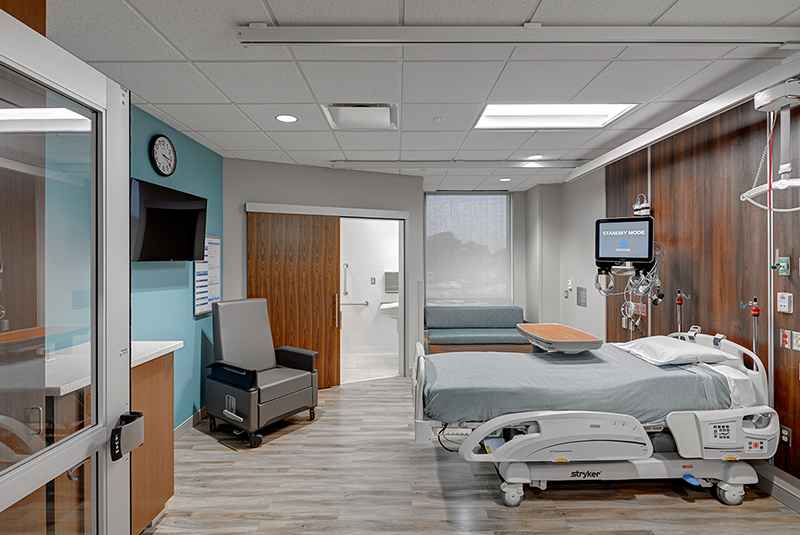 Hospital room with ADA sliding door on the bathroom.