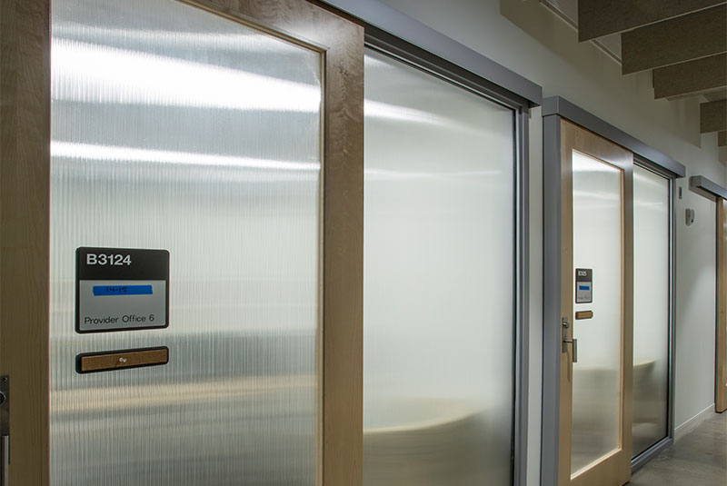 Image of a sliding door system perimeter frame in a wellness center. 