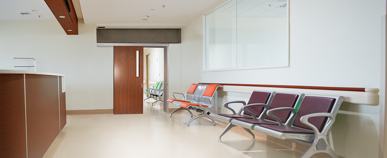 Nurse station waiting area with fire-rated sliding door on the far side of the room