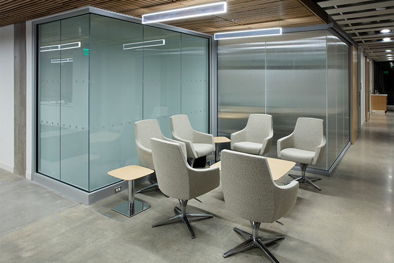 Group meeting room with a wooden sliding office door