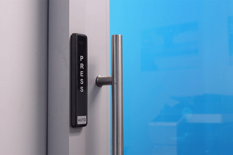 Interior automatic sliding door with a custom giraffe finish and a push button actuator